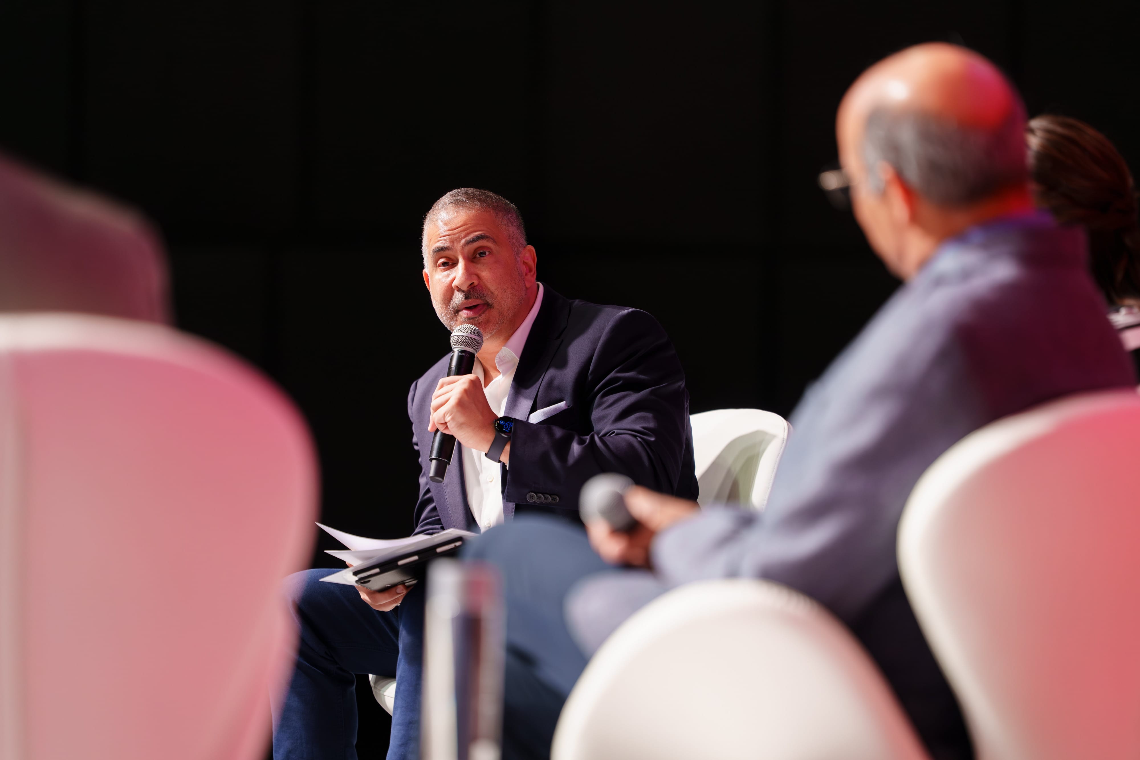 Panelists speaking at Beyond